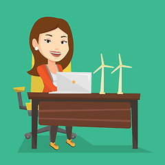 Image showing Woman working with model of wind turbines.