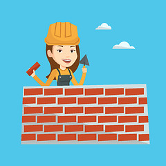 Image showing Bricklayer working with spatula and brick.