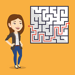 Image showing Business woman looking at labyrinth with solution