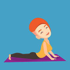 Image showing Woman practicing yoga upward dog pose.