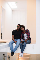 Image showing couple having break during moving to new house