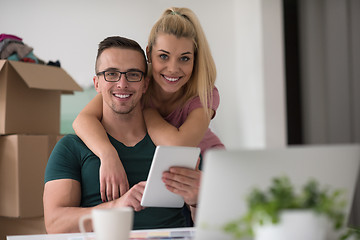 Image showing Young couple moving in a new home