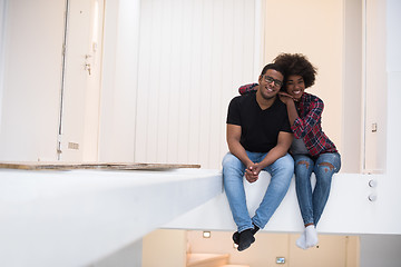 Image showing couple having break during moving to new house