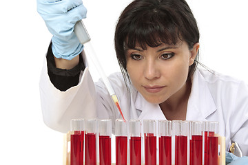 Image showing Obtaining sample from test tube