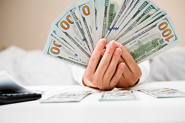 Image showing Hands counting money, close up