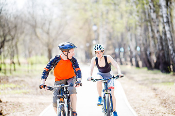 Image showing Guy and girl on bike