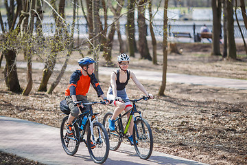 Image showing Athletes on bicycles in park