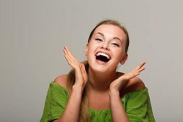 Image showing Satisfied girl in green dress