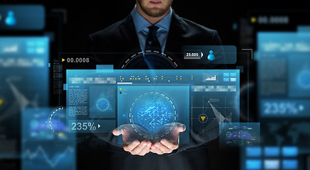 Image showing close up of businessman with virtual screens