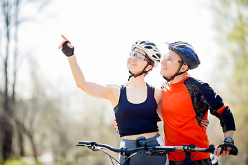 Image showing Couple in helmets with bicycles