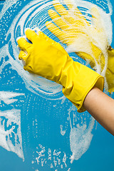 Image showing Person washes with gloves window