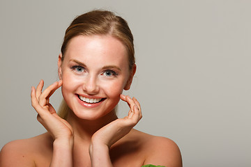 Image showing Smiling model on gray background