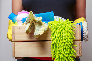 Image showing Man holding box of rags