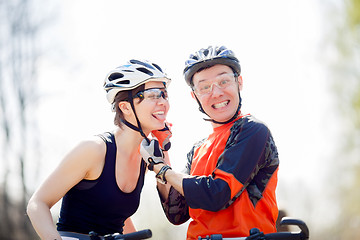 Image showing Bicyclists wear helmets in park