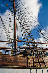 Image showing Old collapsing sailboats at the dock, close-up