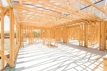 Image showing Wood Home Framing Abstract At Construction Site.