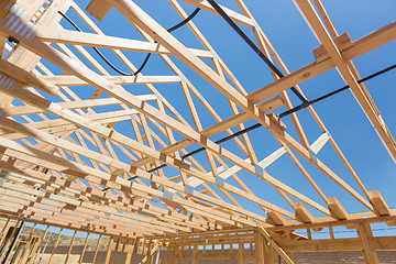 Image showing Wood Home Framing Abstract At Construction Site.