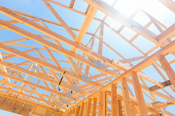 Image showing Wood Home Framing Abstract At Construction Site.