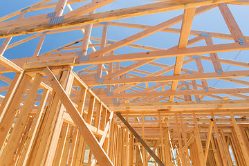 Image showing Wood Home Framing Abstract At Construction Site.