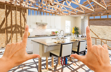 Image showing Hands Framing Transition of New Home Kitchen From Framing To Com