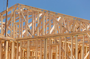 Image showing Wood Home Framing Abstract At Construction Site.