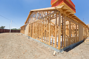 Image showing Wood Home Framing Abstract At Construction Site.