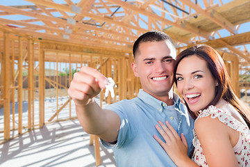 Image showing Young Military Couple On Site With House Keys Inside Their New H