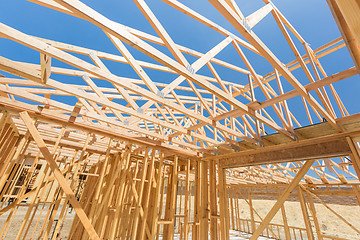 Image showing Wood Home Framing Abstract At Construction Site.