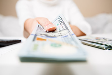 Image showing Hands of person proposing money to you - closeup shot