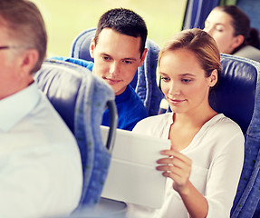 Image showing happy couple with tablet pc in travel bus