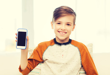 Image showing smiling boy with smartphone at home