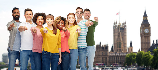 Image showing international group of people pointing on you