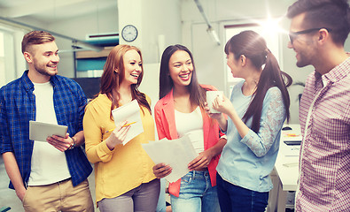 Image showing creative team on coffee break talking at office