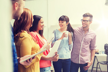 Image showing creative team on coffee break talking at office