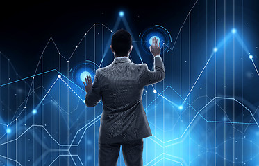 Image showing businessman working with virtual chart projection