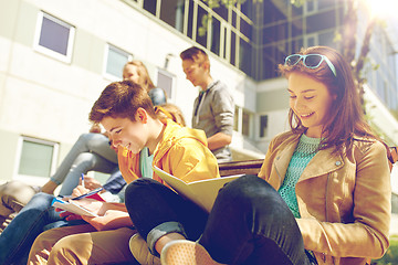 Image showing group of students with notebooks at school yard