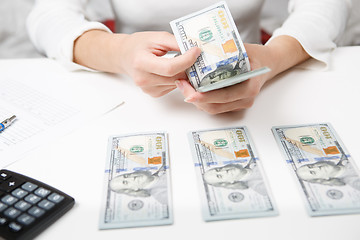 Image showing Hands counting money, close up