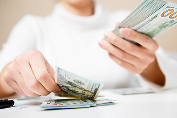 Image showing Hands counting money, close up