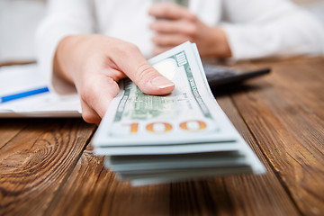 Image showing Hands of person proposing money to you - closeup shot