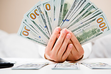 Image showing Hands counting money, close up