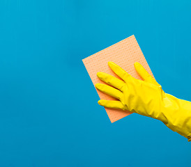 Image showing Man wiping window with rag