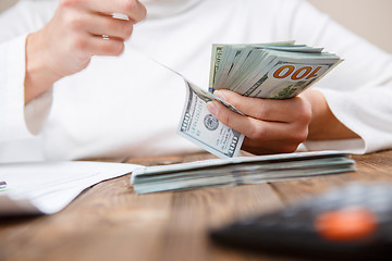 Image showing Hands counting money, close up