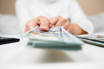 Image showing Hands of person proposing money to you - closeup shot