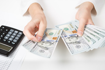 Image showing Hands counting money, close up