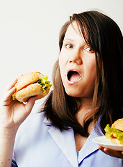 Image showing fat white woman having choice between hamburger and salad close 