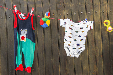 Image showing Clothesline with children\'s clothes