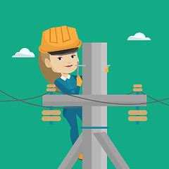 Image showing Electrician working on electric power pole.