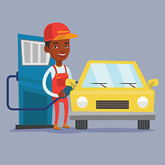 Image showing Worker filling up fuel into car.