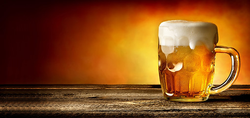 Image showing Beer on timber table