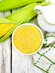 Image showing Corn grits in white bowl on board top